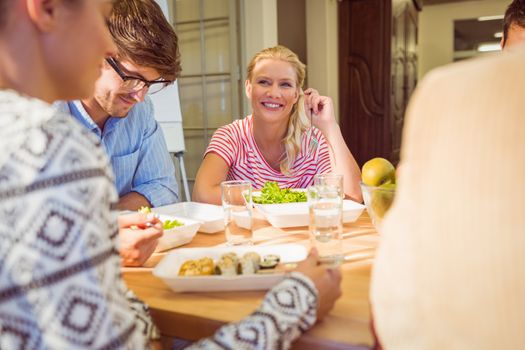 Young business people having lunch together