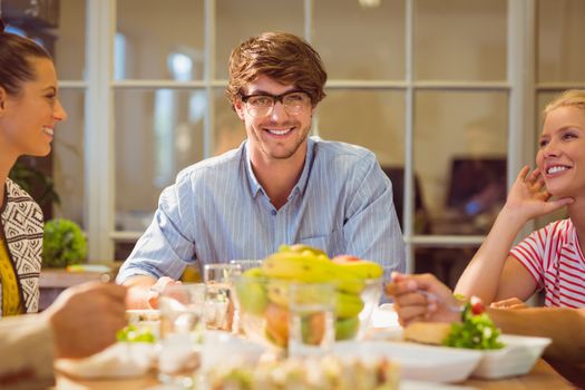 Young business people having lunch together