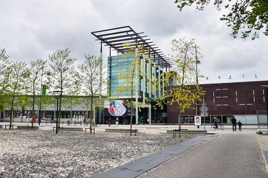 Rotterdam, Netherlands - May 9, 2015: People visit Het Nieuwe Institut museum on May 9, 2015 in Rotterdam, Netherlands. This museum is a cultural institute for architecture and urban development.