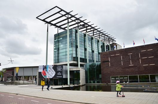 Rotterdam, Netherlands - May 9, 2015: People visit Het Nieuwe Institut museum on May 9, 2015 in Rotterdam, Netherlands. This museum is a cultural institute for architecture and urban development.