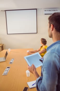 Attentive business team following a presentation in the office