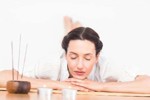 a woman in a meditation position against a white background