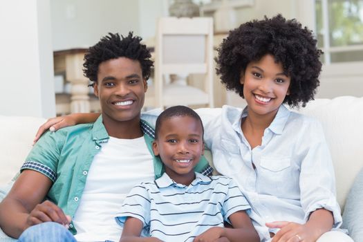 Happy family on the couch at home in the living room