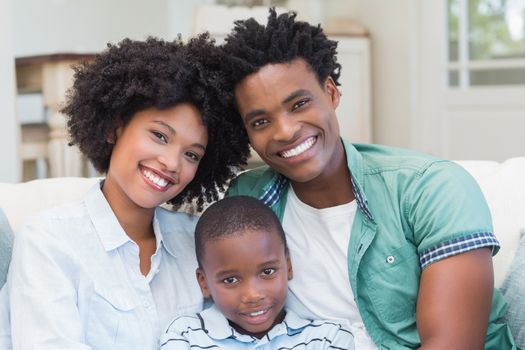 Happy family on the couch at home in the living room