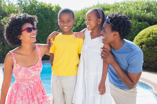 Happy family smiling at each other in the garden at home