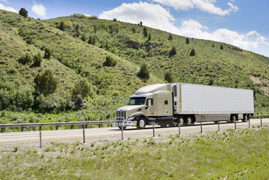 Shot of a big trucks traveling along the highway of the america.