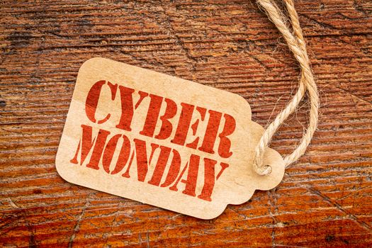 Cyber Monday sign - a paper price tag against rustic red painted barn wood