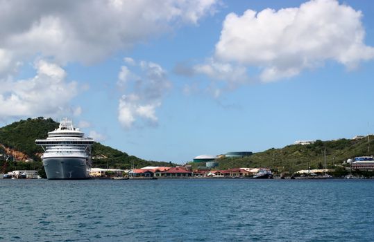 Cruise ship anchored near tropical island