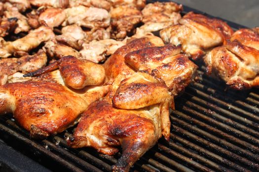 Grilled barbecue chicken on open grill
