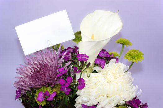 Flower arrangement with a blank white card