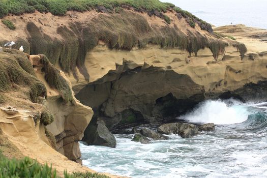 Ocean waves under the cliff