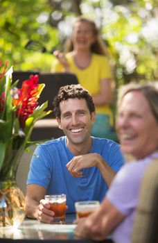 Happy man and woman on with drinks in Maui