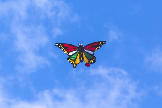 Colorful Kite Butterfly Flying in Blue Sky.