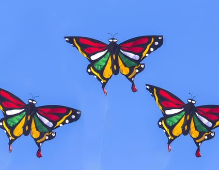 Colorful Kite Butterfly Flying in Blue Sky.
