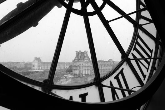 Large clocks with roman numerals in Museum d'Orsay to Musee du Louvre in Paris, France (Black and White)