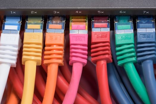 Colorful network cables connected to a switch