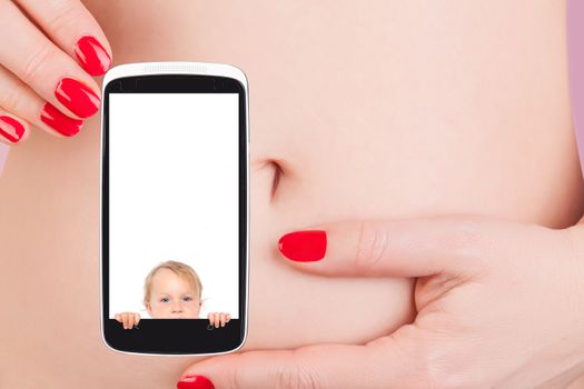 Sexy woman with red nails holding mobile phone with pregnancy test against her belly. The future of medicine, high tech.