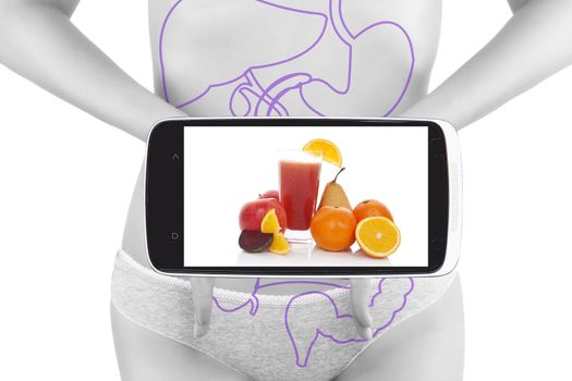 Fitness and healthy eating in the information age. Smartphone app with healthy food in female hands on belly.