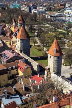 TALLINN, ESTONIA - APRIL 25, 2015 : Top view of Tallinn with high fortresses, cityscape with towers and parks.