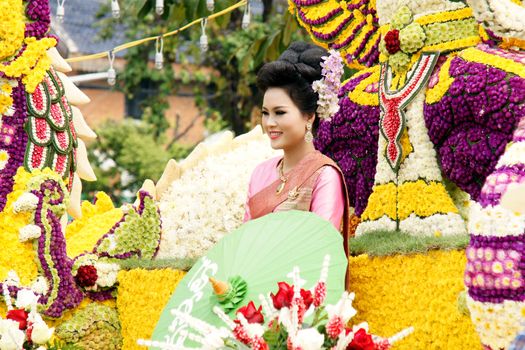 CHIANGMAI, THAILAND - FEBRUARY 2-2013 : Unidentified Thai people on the parade in ChiangMai Flower Festival 2013 at ChiangMai, Thailand.