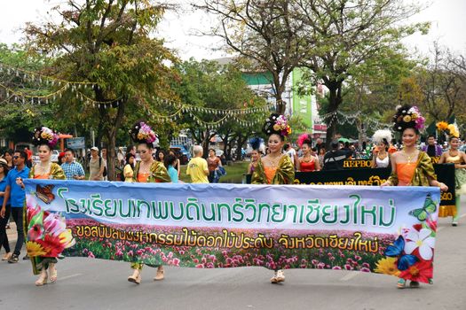 CHIANGMAI, THAILAND - FEBRUARY 2-2013 : Unidentified Thai people on the parade in ChiangMai Flower Festival 2013 at ChiangMai, Thailand.