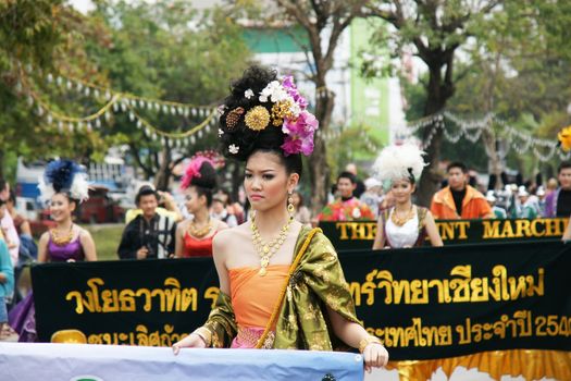 CHIANGMAI, THAILAND - FEBRUARY 2-2013 : Unidentified Thai people on the parade in ChiangMai Flower Festival 2013 at ChiangMai, Thailand.