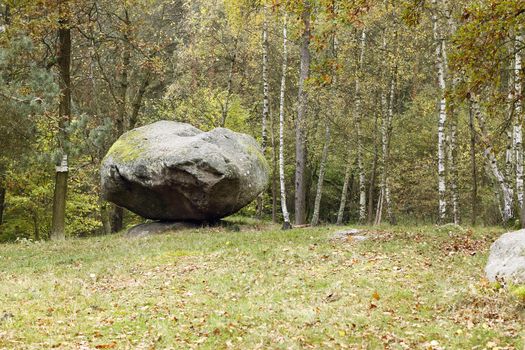 Pulpit of Jan Hus is a protected natural monument of the village Petrovice in Pribram district.
This is a six-foot rocking stone. Located among lots of other stones, but you can not overlook. It is the largest and is the only viklan. Its dimensions are 2 meters in height, 3 meters in length and width measuring 1.8 meters. Other stones are classic and in different sizes. This viklan has hollowed out the top like a bowl measuring 80 and 60 cm. Here, according to legend, became a priest preaching to the people. In ancient times there should happen to the victims. Czech republic.