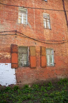 Photo of red brick wall with windows