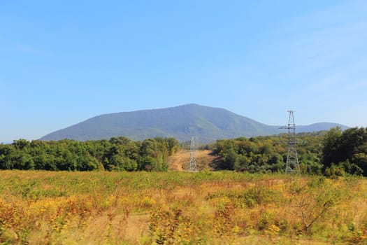 Summer landscape with Russian Caucasus green mountains