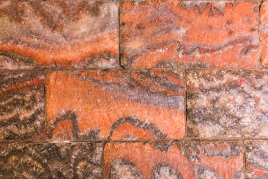 Photo of wall red stone tiles texture