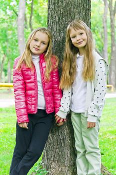 Photo of two cute girls with long hairs