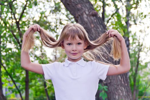 Photo of girl playing with long hair