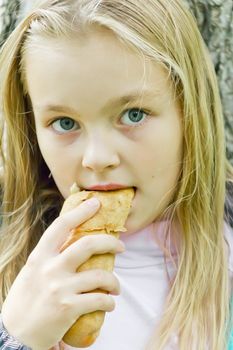 Photo of eating cute girl with blond hair