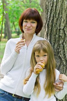 Photo of mother and daughter are eating