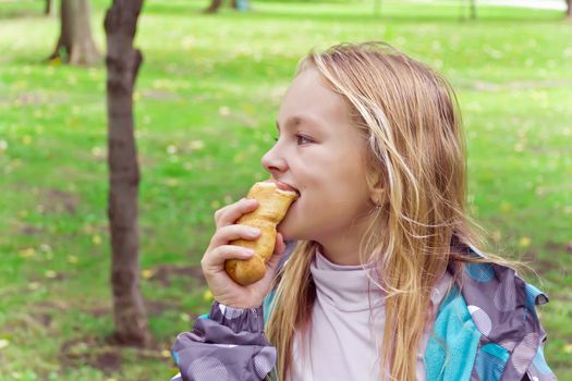 Photo of eating cute girl with blond hair