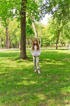 Photo of cute girl with long hair in summer