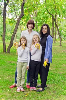 Photo of group people are eating bananas