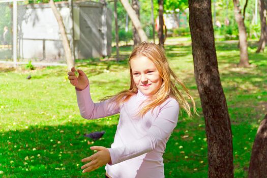 Photo of cute playing girl in summer
