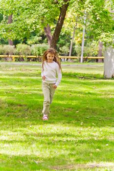Photo of cute running girl in summer