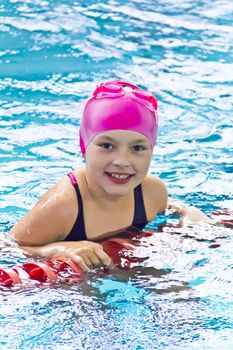 Photo of cute girl in swimming pool