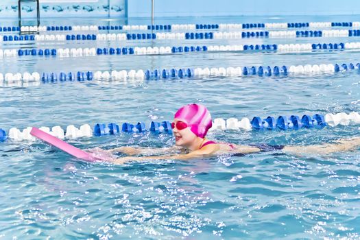 Photo of cute girl in swimming pool