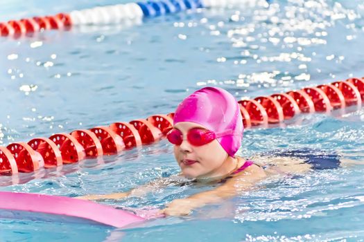 Photo of cute girl in swimming pool
