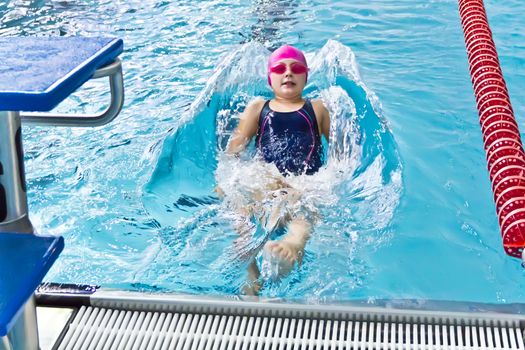 Photo of cute girl in swimming pool