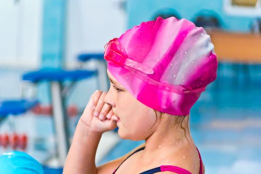 Photo of cute girl in swimming pool