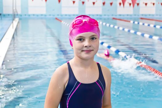 Photo of cute girl in swimming pool