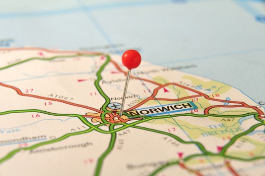 Norwich, United Kingdom, Europe. Push pin on an old map. Selective focus. From the bok "KAK Bilatlas Europa" with ISBN 9147808780.