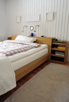 Quiet master bedroom with soft daylight illuminating the room