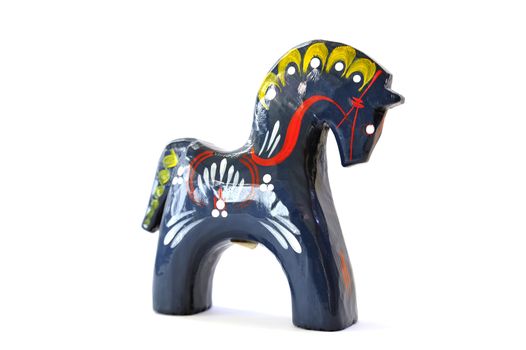 Swedish dalahorse (dalahäst) from Nusnäs in Dalarna. Made from pine and hand painted in traditional pattern. Isolated on pure white. Clipping path included.