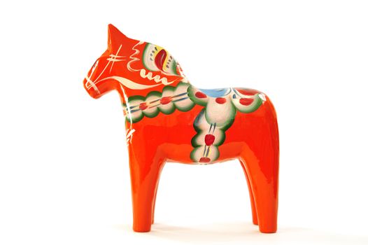 Swedish dalahorse (dalahäst) from Nusnäs in Dalarna. Made from pine and hand painted in traditional pattern. Isolated on pure white. Clipping path included.