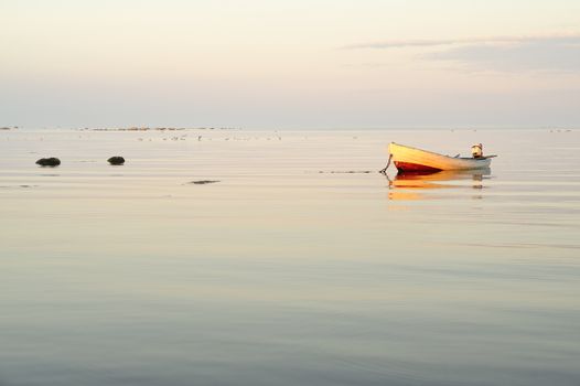 Boat on Calm Lake at Sunrise.